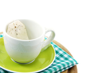 cup and tea bag isolated on white background