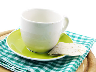 cup and tea bag isolated on white background
