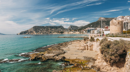 Fototapeta premium Calp quay with the remains of old Roman tower in Alicante, Spain.