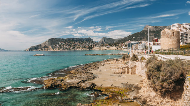 Calp quay with the remains of old Roman tower in Alicante, Spain.