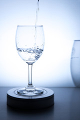 Water is poured into a glass