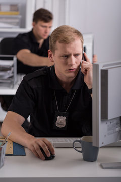 Man working on police helpline