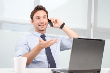 Fototapeta premium Call center operator talking on mobile phone 