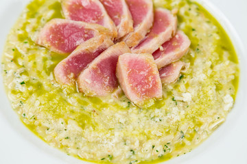 tuna risotto with pieces serving in restaurant