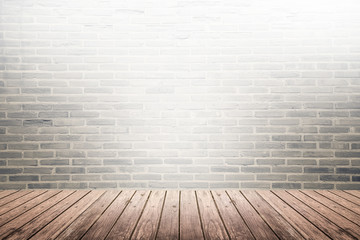 Old interior room with brick wall and wood floor