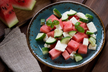 Watermelon, cucumber and bryndza cheese salad on a plate