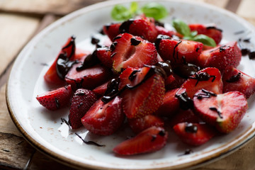 Close-up of strawberry slices with chocolate, selective focus