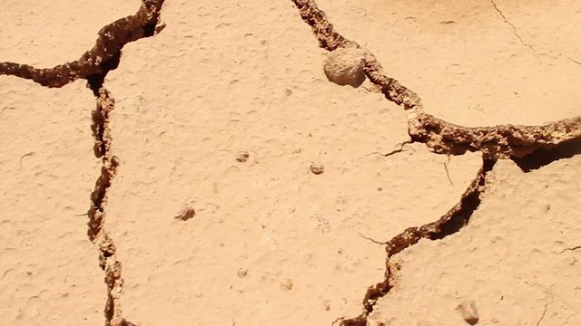 DROUGHT & DESERT - Dolly diagonally across hot and dry cracked parched earth (version #3)
