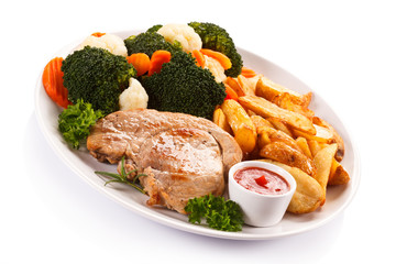 Steak, baked potatoes and vegetables 