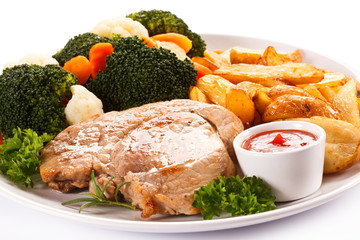 Steak, baked potatoes and vegetables 
