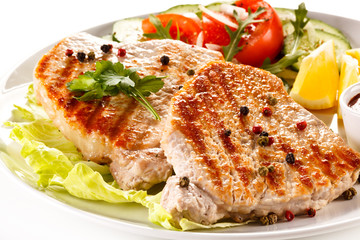 Grilled steaks and vegetable salad 