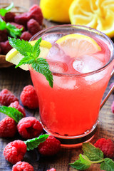 Refreshing homemade lemonade with raspberries and fresh mint