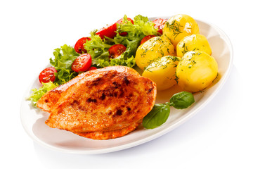 Fried chicken fillet, boiled potatoes and vegetable salad 