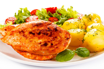 Fried chicken fillet, boiled potatoes and vegetable salad 