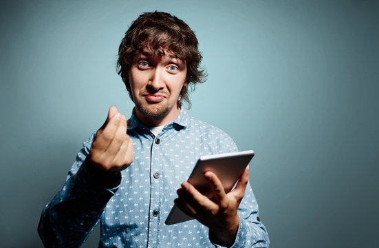 Closeup portrait shouts cheerful young man working on digital