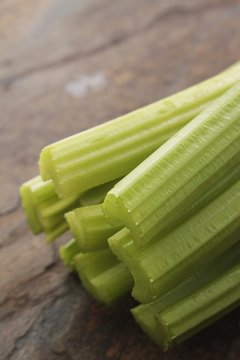 fresh cellery sticks on slate background