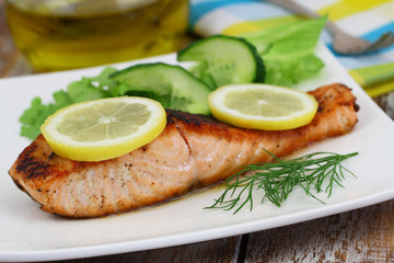 Grilled salmon fillet with lemon and dill
