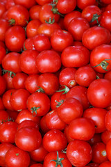 background with fresh red tomatoes in market
