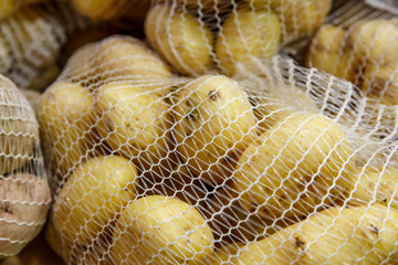 potatoes in the mesh bags at farmers market