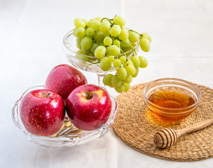 Honey, apples and grapes for Jewish New Year celebration.