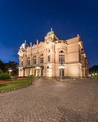 Juliusz Slowacki theatre in Krakow, Poland. Night view of illuminated XIXth century building, built in eclectic style.