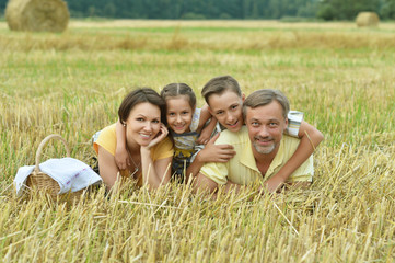 Happy family in wheat field