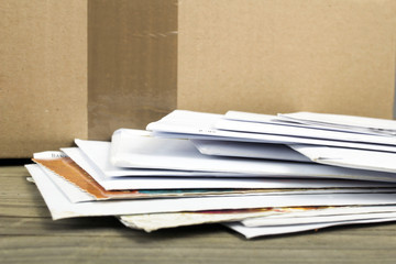 a pile of letters and postal parcel