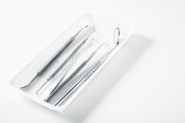 Metal dental medical equipment tools on tray