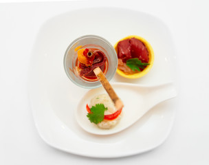 Small snacks on plate, light background