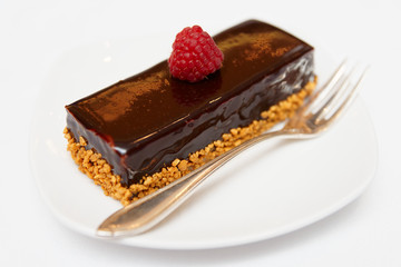 Piece of chocolate cake in small plate