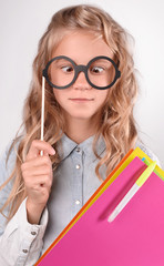 focused schoolgirl in glasses