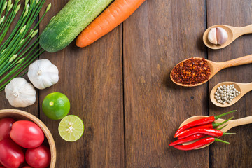 tomatoes, Red chilli, garlic and lemon on wooden background