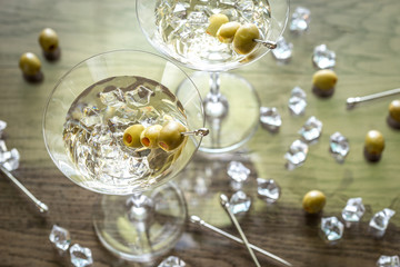 Two olive martini cocktails - obrazy, fototapety, plakaty