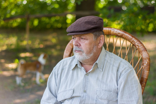Outdoor portrait of senior bearded in a park