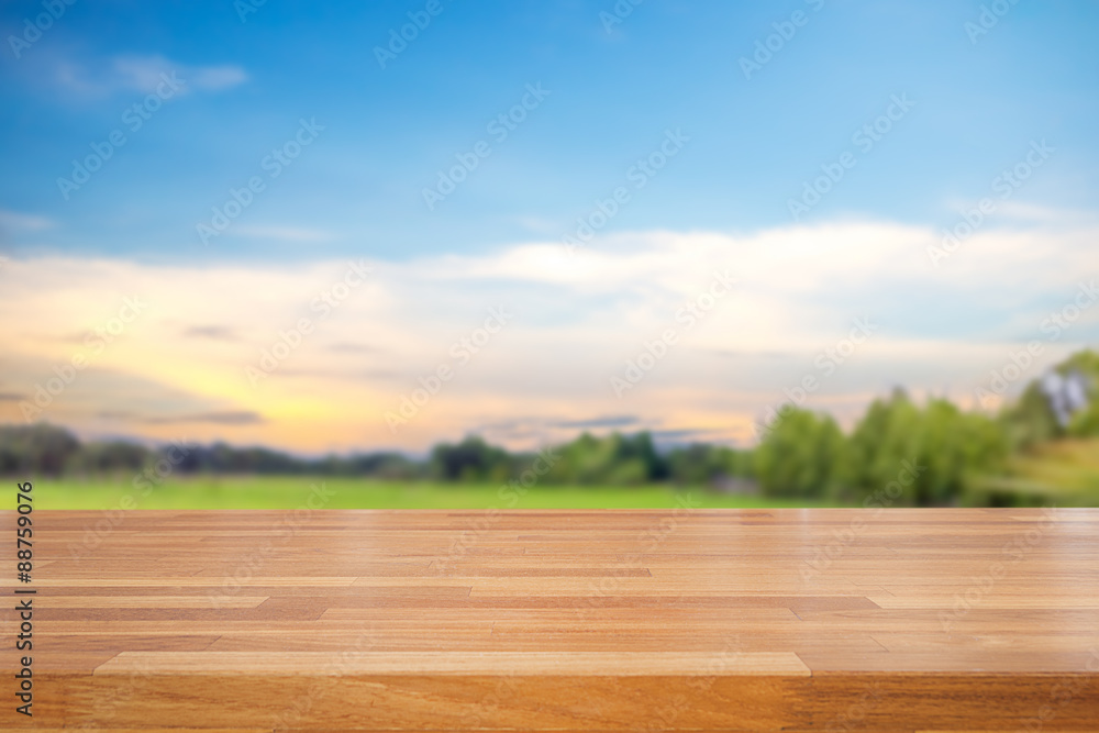 Poster empty table and field of grass and perfect sky background