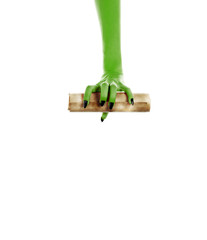 Monster hand holding a folded roll of old paper (letter or invite)