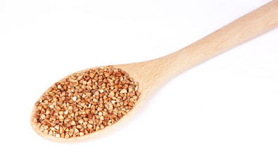 Buckwheat in a spoon on a white background