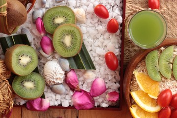 Fototapeta na wymiar Oat flakes with fruit, kiwi, orange, tomato and kiwi juice.