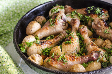 Crisp-tender chicken baked  with roasted carrots and potatoes, shallow focus