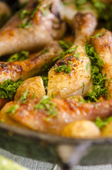 Crisp-tender chicken baked  with roasted carrots and potatoes, shallow focus