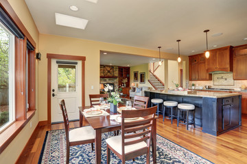 Simple dinning room with large windows.