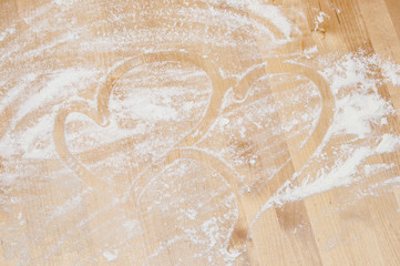 heart on desk and flour