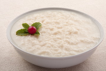 Homemade rice porridge with fresh cream.