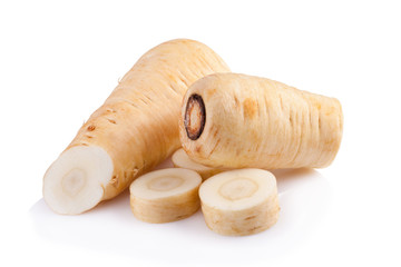 Fresh parsnip roots on a white background