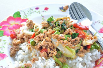 Rice topped with stir fried pork and basil