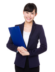 Fototapeta na wymiar Asian young Businesswoman hold with clipboard