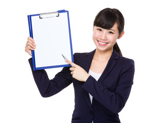 Young Businesswoman showing blank page of file board