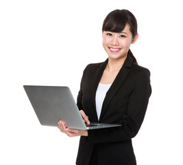 Young Businesswoman use of the notebook computer