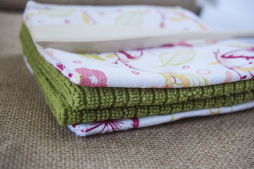 Kitchen rags are used for wiping or cleaning something in a kitchen such as floor, counter or utensils.