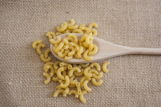 Macaroni is a dry pasta and made of durum wheat, usually no egg. In this picture is an elbow macaroni.